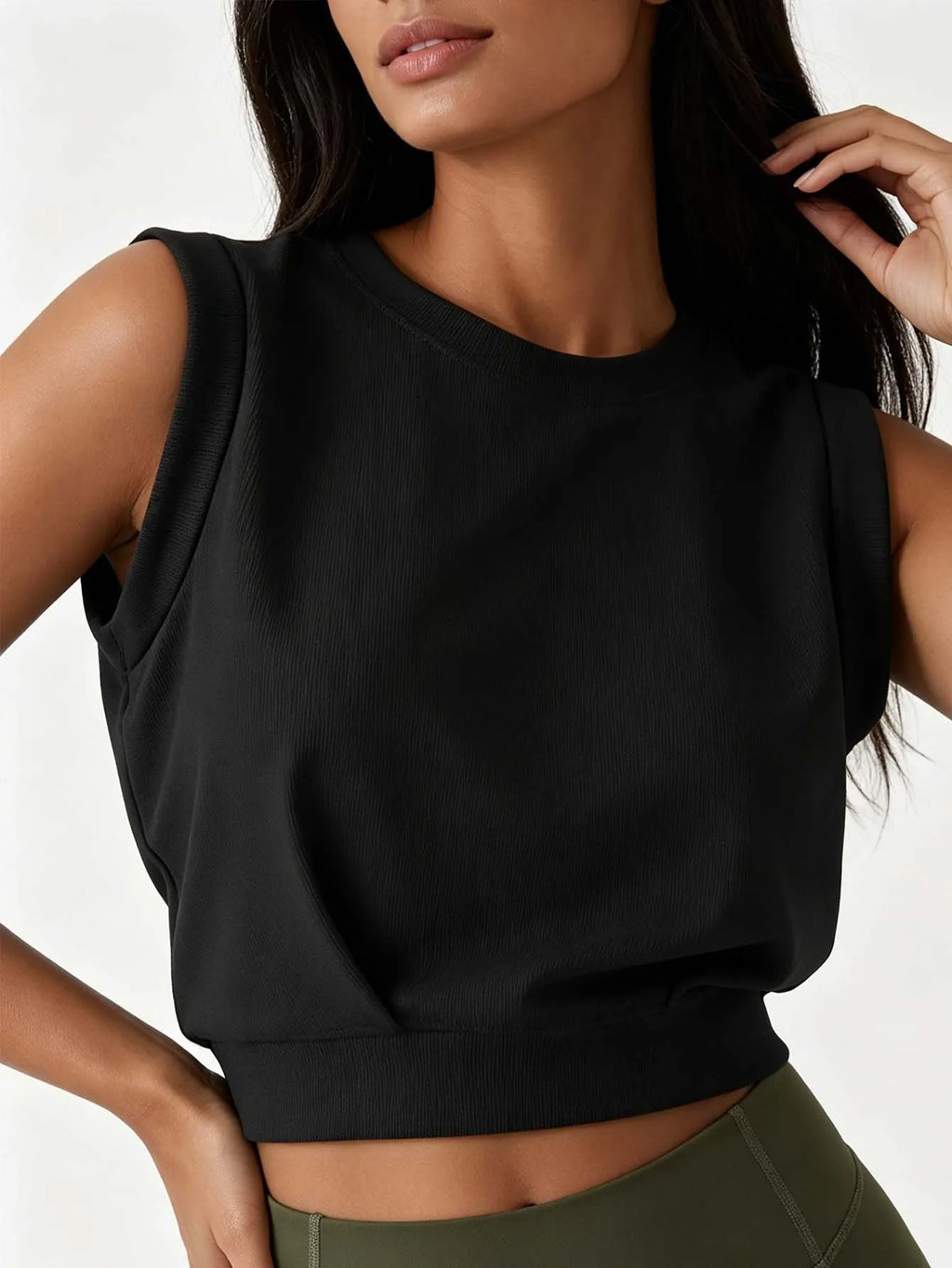Lady's ribbed round-neck sleeveless fitted crop top, solid color