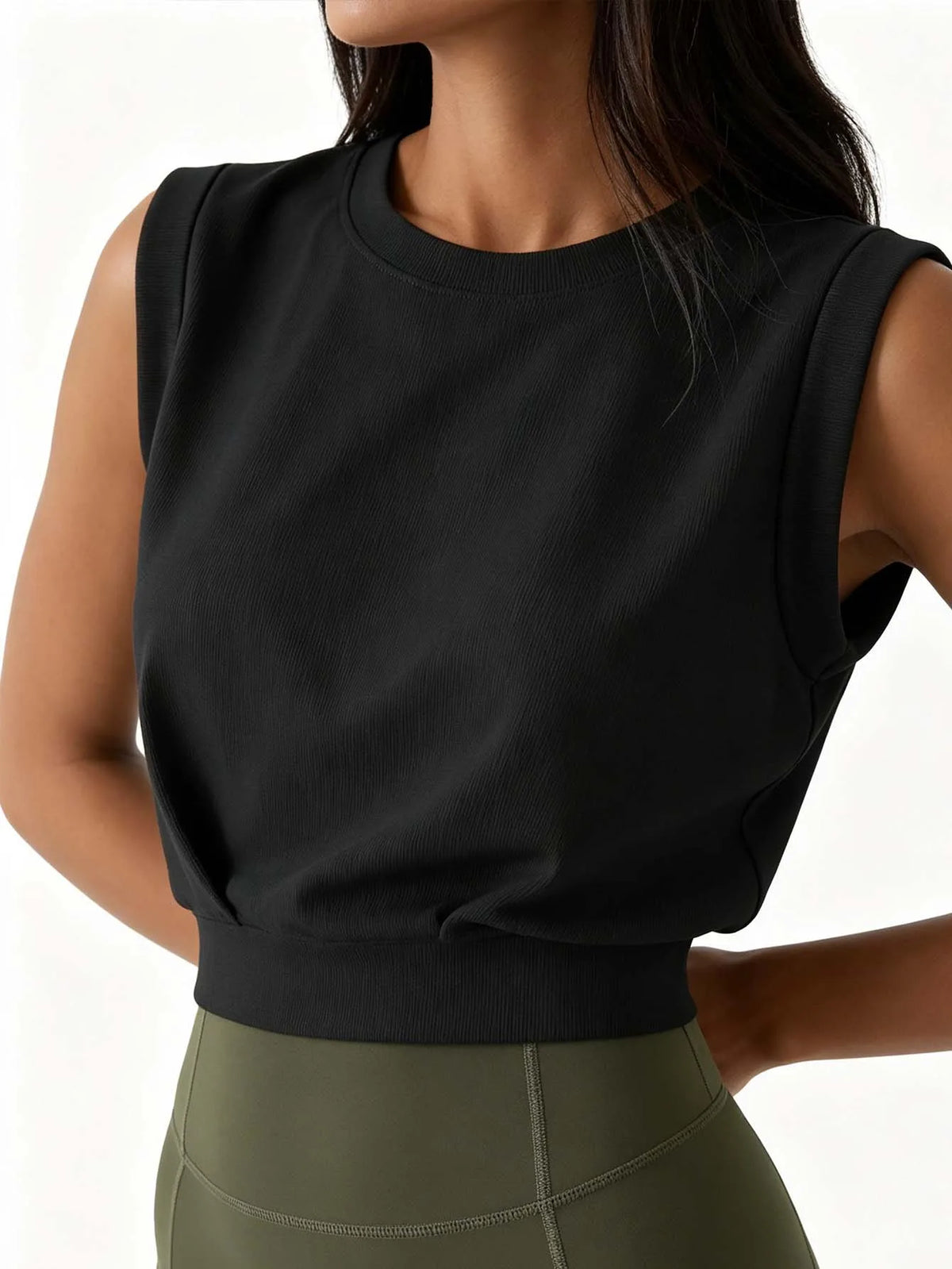 Lady's ribbed round-neck sleeveless fitted crop top, solid color