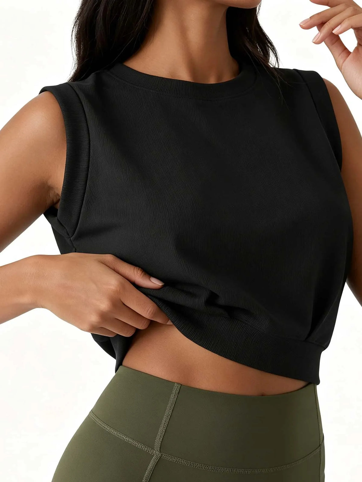 Lady's ribbed round-neck sleeveless fitted crop top, solid color