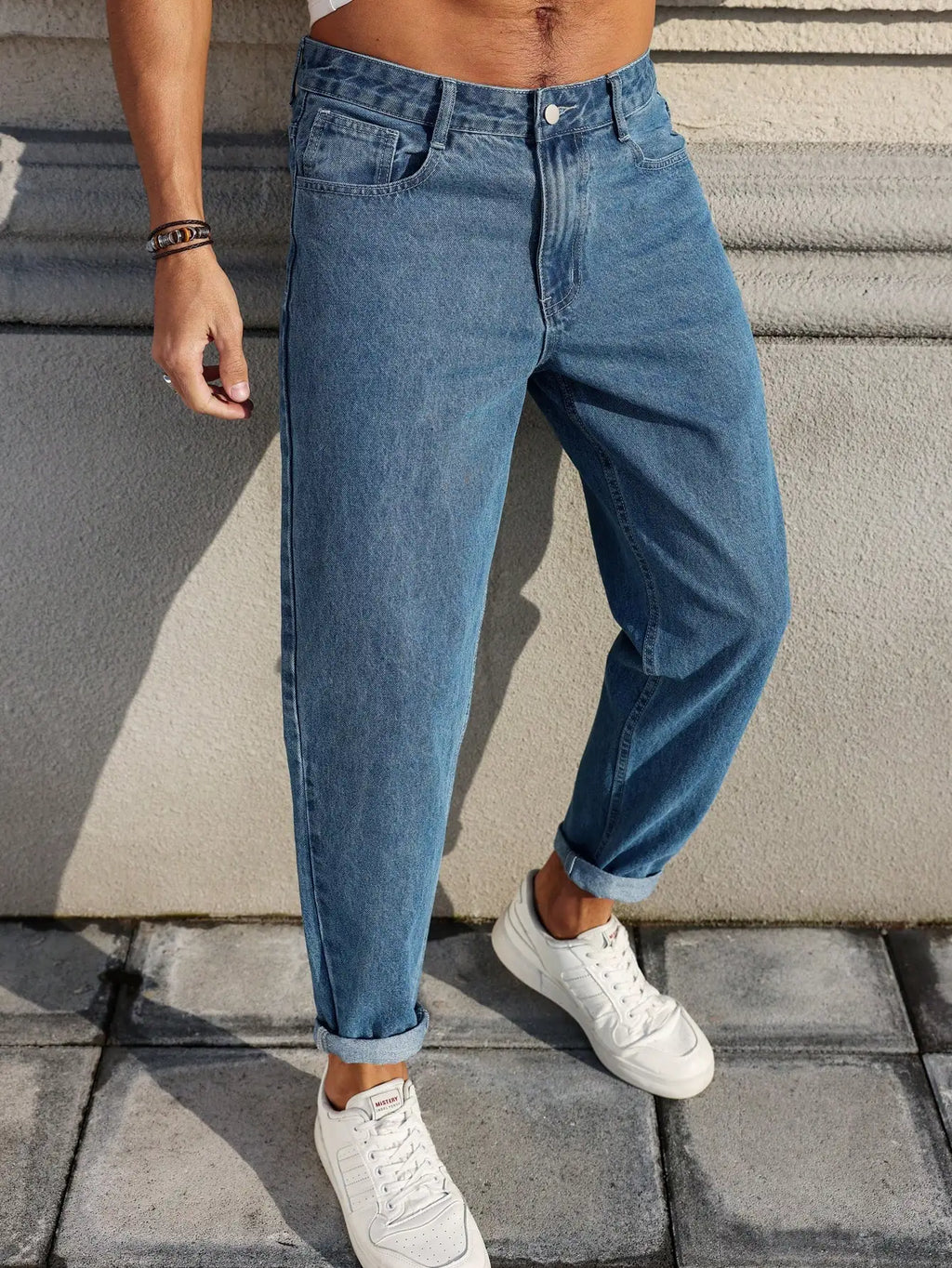 Men's Jeans Are Made of Classic Blue Denim Fabric with a Loose Fit,