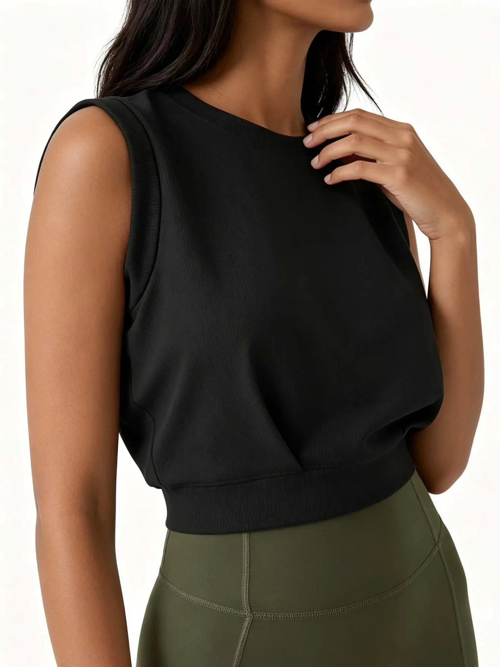Lady's ribbed round-neck sleeveless fitted crop top, solid color